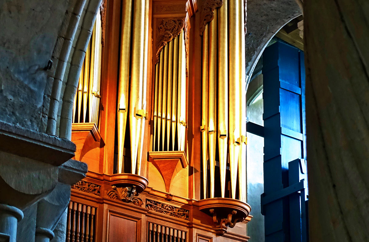 The pipes of this church organ located in Norwich, England produce different pitch and tone. The key of a song tells us which pipes we can sound safely to stay in harmony.
